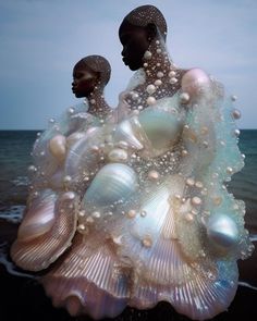 an image of two people standing next to each other with bubbles on their body and in the water