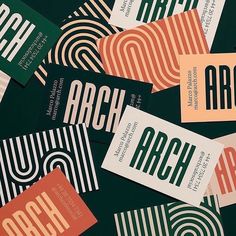 many business cards are stacked on top of each other with the word arch printed on them