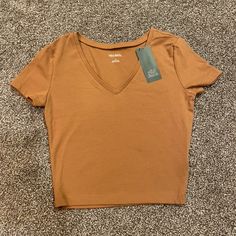 Target V-Neck Tee Tan/Brown Color Size Small Tighter Fit, Cropped Brand New, Never Worn! Casual Brown V-neck Top, Trendy Brown V-neck Top, Super Cropped Top, Target Shirt, Polo Crop Top, White Crop Top Tank, Baby Crop Top, Spaghetti Strap Crop Top, Tan Woman