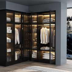 a walk in closet filled with lots of clothes