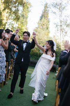 a newly married couple walking down the aisle