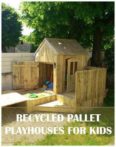 a child's play house made out of pallet wood