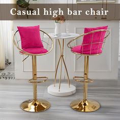 two pink and gold bar stools sitting next to each other