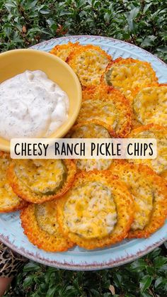 cheesy ranch pickle chips on a plate with dip