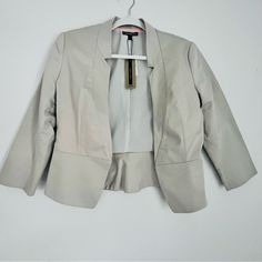 Nwt Express Cotton Sateen Women’s 3/4 Sleeve Cropped Blazer Fully Lined. Color: Light Cream/Tan. Size: 6. One Hook Closure. Fabric: She’ll: 99% Cotton. 1% Spandex. Lining: 99% Polyester. 1% Spandex. Approx. Measurements (Flat): Length: 22%. Underarm To Underarm: 18”. Sleeve: 19”. New With Tag - No Visible Damage, Stains Or Flaws. Fitted Neutral Blazer For Spring, Beige 3/4 Sleeve Outerwear For Spring, Beige 3/4 Sleeve Outerwear For Fall, Light Grey Blazer, Black Suit Jacket, Single Button Blazer, Green Blazer, Denim Blazer, Red Blazer