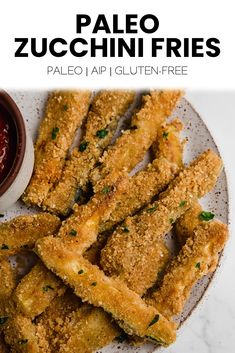 fried fish sticks on a plate with dipping sauce