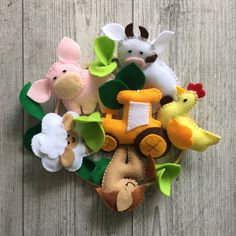 a bunch of stuffed animals sitting on top of a wooden table