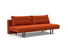 an orange couch sitting on top of a white floor