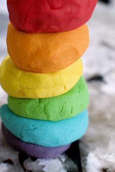 a stack of colorful doughnuts sitting on top of each other