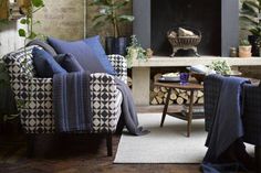 a living room filled with furniture and a fire place