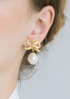 The Khloe Earrings will be the chameleon of your jewelry wardrobe, with a neutral palette loaning versatility to elevate any look. The golden ribbon of these bow earrings has a sculptural nature that suggests movement, and we love the gentle swaying of the baroque crystal pearl drops. We also suggest the larger Eloise Earrings for a statement look.