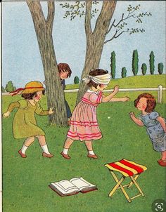 children playing in the park with an open book