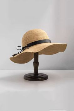 Elegant and Functional Summer Hat This packable floppy straw hat is made from 100% raffia, offering flexibility and breathability. The wide brim ensures full face sun protection, and the hat can be easily folded for travel. A chic bow adds a touch of elegance, making it perfect for any summer outing. Style #: WWAJ532 Packable Wide Brim Straw Hat, Packable Flat Brim Straw Hat For Beach, Packable Natural Straw Hat, Natural Color Summer Straw Hat Packable, Packable Summer Straw Hat In Natural Color, Natural Packable Straw Hat For Vacation, Packable Natural Straw Summer Hat, Packable Natural Straw Hat For Vacation, Lightweight Curved Brim Straw Hat