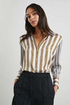 The Dorian Shirt by Rails is a luxe 100% silk charmeuse vertical stripe button-down. This shirt will elevate any outfit either buttoned or unbuttoned over a t-shirt. Available in Providence and Bronze Mix. Silk Button Up, Fall Denim, Stripe Silk, Silk Charmeuse, Denim Shop, Stripe Print, Silk Blouse, Winter Women, Striped Shirt