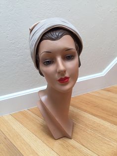 Circa: Late 1950s Early 1960s Escape to well, anywhere really. You gals are the Jet setters on BOAC and you have to be the most stylish. Oatmeal beige rayon velvet supporting a Champagne beige satin piled up on top of plush heights. This turban is going places - be sure to be with it! DO YOU ACCEPT OFFERS? We do NOT accept offers or negotiate on pricing. We do offer layaways and have sales throughout the year. Shipping overages are always refunded. Label: Union label Fabric: rayon velvet, rayon Vintage Beige Hat, 50s Turban, Adjustable Vintage Cream Cloche Hat, Cream Wide Brim Vintage Fascinator, Adjustable Beige Vintage Cloche Hat, Vintage Cream Adjustable Cloche Hat, Beige Adjustable Vintage Cloche Hat, Vintage Adjustable Cream Cloche Hat, Vintage Adjustable Beige Fascinator