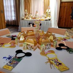 a table topped with lots of different types of items on top of a white table cloth