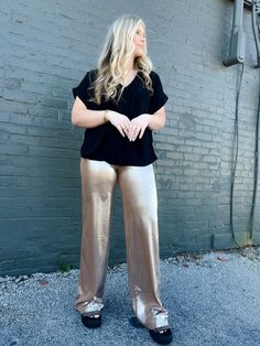 Indulge in glamour with our Out For Drinks Pants! These Metallic Wide Leg Knit Pants feature an elastic waist band in a luxurious gold color. Perfect for a night out, these pants will elevate your look and keep you comfortable all evening long. Add a touch of shine and style to any occasion with these must-have pants. 35" inch inseam. Trendy Gold Bottoms For Parties, Metallic Bottoms With Elastic Waistband For Party, Sleek Metallic Bottoms For Party, Glamorous Party Bottoms With Sheen, Glamorous Sheen Bottoms For Party, Chic Spring Bottoms With Sheen, Chic Sheen Bottoms For Spring, Party Pants In Metallic Color With Sheen, Chic Spring Sheen Bottoms