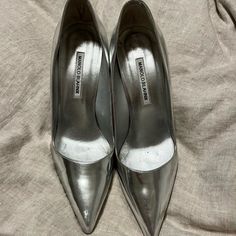 Manolo Blahnik Classic Platinum Silver Pumps, Women’s European Size 40, Us Size 9. Perfect Condition!! Worn Less Than Five Times. Really Comfortable For A High Heel. Original Box And Duster Bag Included. Classic Silver Heels With 4-inch Heel, Silver Fitted Court Shoes For Formal Occasions, Silver Formal Court Shoes, Formal Silver Court Shoes, Classic Silver High Heels, Silver Formal Court Shoes With Padded Heel, Formal Silver Court Shoes With Padded Heel, Glamorous Formal Court Shoes With Closed Toe, Glamorous Pointed Toe Heels For Galas