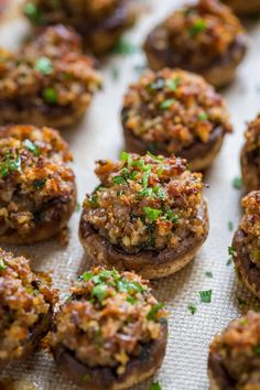 small stuffed mushrooms are on a baking sheet