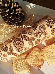 some pine cones are sitting on a table