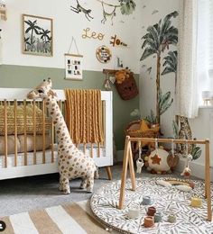 a baby's room with a giraffe in the corner and other toys on the floor