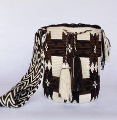 Mochila purse made by artisans of the Wayuu Indigenous Group in Colombia Purchased directly from Artisan, on a Fair Trade Basis Fully Handmade For each Wayuu Mochila Bag purchased, Hands of Colombia donates thread to Indigenous Artisans. Only ONE available Wayuu Mochila Purses are famous for their stunning designs and unique character. Each purse is handmade, full of expression and character. SIZE - Large. 12 inches deep (30.5cm), 13 inches wide (33cm). Comfortably fits large items: use as an ev Artisan Bucket Bag For Travel, Artisan Woven Shoulder Bag As Gift, Artisan Woven Bag As A Gift, Artisan Rectangular Bucket Bag For Festivals, Artisan Woven Bag As Gift, Artisan Woven Shoulder Bag Gift, Artisan Handmade Bucket Shoulder Bag, Handmade Rectangular Bucket Bag For Festivals, Traditional Bucket Bag With Weaving For Travel