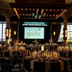 a large banquet hall with tables and chairs set up for a formal function at gaia