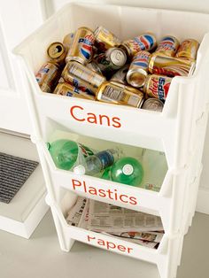 a bin with cans and plastics in it