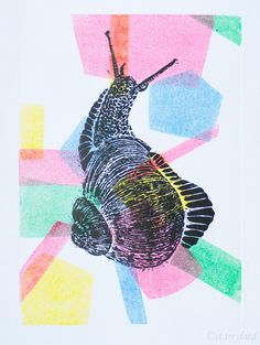 a drawing of a snail on white paper with multicolored squares in the background