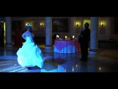 the bride and groom are dancing at their wedding reception in an elegant room with columns