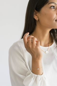 This sleek gold chain bracelet with a graceful oval-shaped mother of pearl centerpiece complements all styles. This sweet bracelet is perfect for mixing in a stack or wearing solo for a minimal look. Made with recycled metals, for the earth friendly at heart. Recycled 14k gold filled Available in 6.5" or 7.5" lengths Both lengths include a 1/2" long extender chain Mother of Pearl is 4mm x 6mm Classic White Chain Bracelet For Everyday, Everyday Classic Jewelry With Oyster Bracelet, Classic Pearl Bracelet With Adjustable Chain For Everyday, Classic Everyday Pearl Bracelet With Adjustable Chain, Delicate Chain Bracelet For Layering, Minimalist Everyday Jewelry With Pearl Charm, Classic Everyday Pearl Bracelet, Delicate Bracelets For Layering, Delicate Layering Bracelets