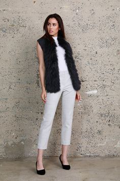 Constructed with the option of an open or closed front. This versatile raccoon trim vest can be worn over a turtleneck and trousers or a knit dress for down to earth and glamorous feel. Item #: 71790 30% Wool, 70% Acrylic, 100% Raccoon Colors: Available in Blue XS=0, S=2-4, M=6-8, L=10, XL=12 Details & Care Instructions Knit vest Sleeveless Wool blend Fur trim Hook & eye closure Slim fit Dry clean Imported Sizing and Fit True to size Chest width: 17 7/8" Waist: 16 3/4" Front length: 24 5/8" Bott Chic Fitted Sweater Vest For Winter, Chic Wool Vest For Fall, Chic Fall Wool Vest, Sleeveless Fur Coat With Faux Fur Trim For Fall, Chic Fitted Fur Coat With Feather Trim, Chic Fitted Fluffy Fur Coat, Chic Sleeveless Outerwear With Faux Fur Trim, Chic Faux Fur Vest For Fall, Chic Fluffy Fitted Fur Coat