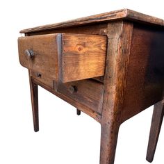 an old wooden table with two drawers