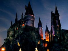 the hogwarts castle is lit up at night