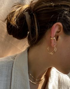 Get the look of a cartilage hoop, no piercing required. These ear cuffs are designed with the perfect amount of thickness and comfort so you can wear them every day - quite literally you never have to take them off. They can be worn in the shower + while you sleep. Simply slide onto the conch part of your ear and go. Wear one for a minimal look or grab a pair for stacking. Everyday Pierced Ear Cuff, Adjustable Single Ear Cuff For Everyday Wear, Trendy Hypoallergenic Ear Cuff For Everyday Wear, Trendy Tarnish-resistant Everyday Piercings, Adjustable Minimalist Hoop Ear Cuff, Trendy Hoop Ear Cuff For Pierced Ears, Trendy Hoop Ear Cuff With Piercing, Everyday Single Ear Cuff With Open Ring, Trendy Huggie Ear Cuff For Pierced Ears