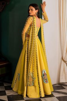 Yellow panelled lehenga with bead, cutdana and pearl embroidery and attached cancan. Paired with a padded embroidered bustier and choker style dupatta.
Components: 3
Pattern: Embroidered
Type Of Work: Bead, Cutdana, Pearl
Neckline: Straight
Sleeve Type: Long
Fabric: Muslin
Color: Yellow
Other Details: 
Attached lining
Closure:
Lehenga: Button
Occasion: Mehendi and Haldi - Aza Fashions Festival Hand Embellished Raw Silk Lehenga, Festive Hand Embellished Raw Silk Lehenga, Semi-stitched Hand Embellished Raw Silk Lehenga, Hand Embellished Raw Silk Lehenga For Diwali, Diwali Hand Embellished Raw Silk Lehenga, Unstitched Hand Embellished Lehenga In Organza, Hand Embellished Floor-length Raw Silk Lehenga, Traditional Hand Embellished Organza Lehenga, Diwali Anarkali Style Pre-draped Saree Hand Embellished