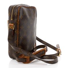 This is an authentic LOUIS VUITTON Monogram Danube 21. This style shoulder bag is crafted of traditional Louis Vuitton monogram on coated canvas. The crossbody bag features an adjustable shoulder strap with polished brass hardware, vachetta cowhide leather trim, and an exterior pocket. The top zipper opens to an interior of cross-grained leather with a patch pocket. Louis Vuitton Monogram Bag, Louis Vuitton Crossbody Bag, Louis Vuitton Crossbody, Louis Vuitton Empreinte, Lv Monogram, Monogram Bag, Weekender Tote, Louis Vuitton Shoulder Bag, Black White Pink