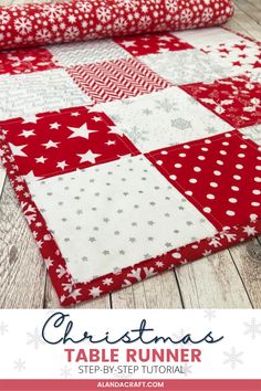 the christmas table runner is made from red and white fabric, with stars on it