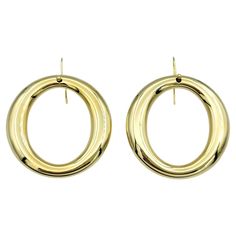 These elegant earrings from Tiffany & Co.'s Elsa Peretti Sevillana collection feature a timeless open circle design, and set in lustrous 18 karat yellow gold. The simplicity of the design is elevated by the luxuriousness of the gold, creating a sophisticated and versatile accessory suitable for any occasion. Whether worn casually or for a special event, they effortlessly enhance any ensemble with their understated elegance and timeless charm. These classic Tiffany & Co. earrings are the perfect addition to any fine jewelry collection. This piece is in very good estate condition and has been professionally cleaned and polished. It comes with an appraisal card, verifying its authenticity and current appraisal value. Metal: 18 Karat Yellow Gold Earring Pair Weight: 15.6 grams Earring Diameter Tiffany Co Earrings, Elsa Peretti, Tiffany And Co, Gold Earring, Fine Jewelry Collection, Yellow Gold Earring, Understated Elegance, Circle Design, Circle Earrings