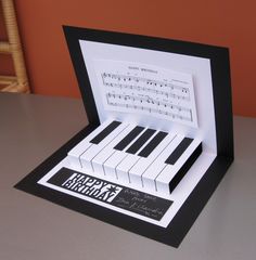 an open musical box with piano keys on it