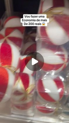 red and white candy canes are stacked on top of each other in a display case