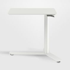 a white table with a metal base on the top and one leg raised up to it's side