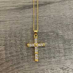 -Gold plated necklace. -Pendant measurement: 2.5cm long, 2cm wide -Chain measurement: 1mm thickness, 20” long + 2” extensor. Gold Plated Adjustable Chain With Cross Pendant, Gold Plated Cross Pendant Jewelry With Adjustable Chain, Metal Cross Necklace With Adjustable Chain For Gifts, Gold Pendant Rhinestone Necklace Gift, Gold Plated Pendant Jewelry 16 Inch Length, Gold Rhinestone Pendant Necklace For Gift, Metal Cross Pendant Chain Necklace As Gift, Metal Chain Necklace With Cross Pendant For Gift, Metal Cross Pendant Chain Necklace For Gift