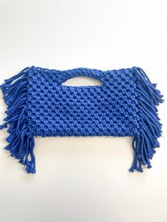 This Macrame Fringe Bag is perfect to grab and go out in town in style! It is a reversible bag which allows you to pick the style you want; fringe or no fringe. You just turn the bag inside out. USES:  Handbag Perfect for keys, phone, and small wallet DETAILS:  Material: 100% Cotton Cord COLOR: Blue Size: Bag measures approx. 8 inches in length and 13 inches wide. Fringe is approx. 4 inches long Care: Spot clean with a damp cloth.  Blot to remove excess water.  Air dry. Click the link to see other listings: https://www.etsy.com/shop/nestedthread FOLLOW ME: Follow me on Instagram @nestedthread Blue Handwoven Top Handle Bag, Everyday Crochet Clutch Bag With Detachable Handle, Blue Woven Top Handle Shoulder Bag, Everyday Rectangular Macrame Shoulder Bag, Blue Crochet Bag With Top Handle For Everyday Use, Blue Woven Clutch Bag, Handmade Blue Hobo Bag For Everyday Use, Wide Fringe, Macrame Clutch