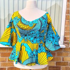 This is an African print ankara jacket/ blouse/Jacket with fit and flar sleeve. Standout in this beautiful handmade 100% cotton African print Top. Whether it's formal meeting or hangout with friends, cocktail party or get together. You can dress the Jacket up or down with your favorite denim, skinny jeans, leggings, skirts, high heels, boots, or sneakers. Measurement Bust 46 Waist 40 Alterations can be made as there is enough seam allowance CARE FOR YOUR ANKARA PRINT JACKET - 100% Cotton African African Print Jacket, African Tops For Women, Ankara Peplum Tops, African Print Kimono, African Shop, Ankara Blouse, Ankara Jackets, African Blouses, African Tops