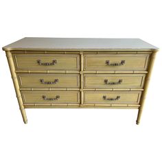 a bamboo dresser with six drawers on each drawer