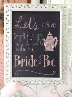 a chalkboard sign that says let's have tea with the bride to be