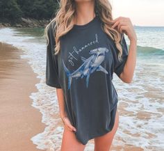 Dive into style with our "Get Hammered" Comfort Colors Shirt, featuring a watercolor hammerhead shark design on the front. Perfect for those who love a good pun and a splash of oceanic flair, this tshirt is your go-to for cozy comfort and making a statement. Whether you're hitting the beach or just chilling with friends, let everyone know you're ready to "get hammered" in the most stylish way possible! PRODUCT FEATURES ⭐The Comfort Colors t-shirt is made with medium fabric and high-quality, 100% Save The Sharks, Shark Tee, Shark Shirt, Hammerhead Shark, Best Puns, Animal Shirts, Comforters Cozy, Tshirt Colors, Comfort Colors