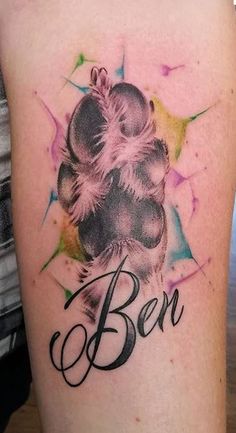 a tattoo with the word ben on it and an image of a dog's paw