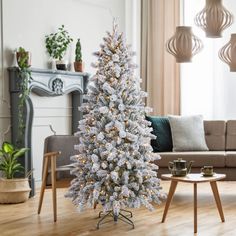 a white christmas tree in a living room